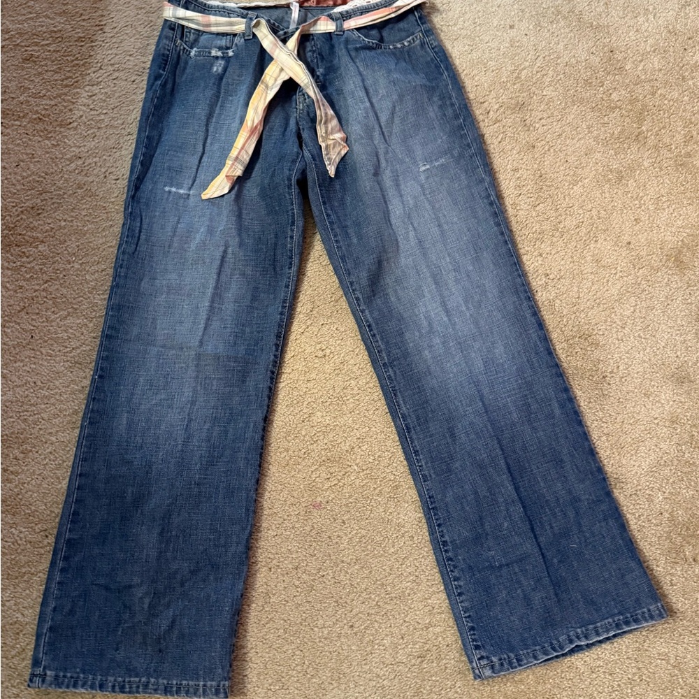 Designer Chipie mildly distressed jeans with zipper and button.